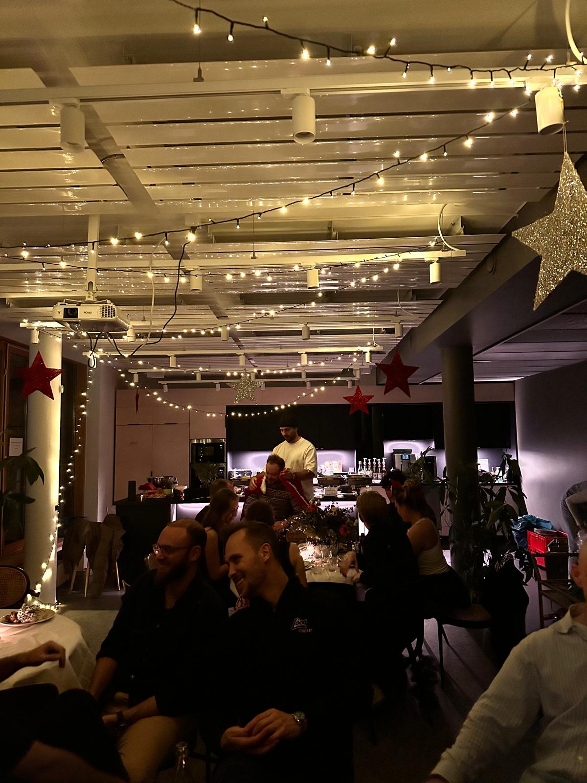 Christmas dinner in the office under fairy lights
