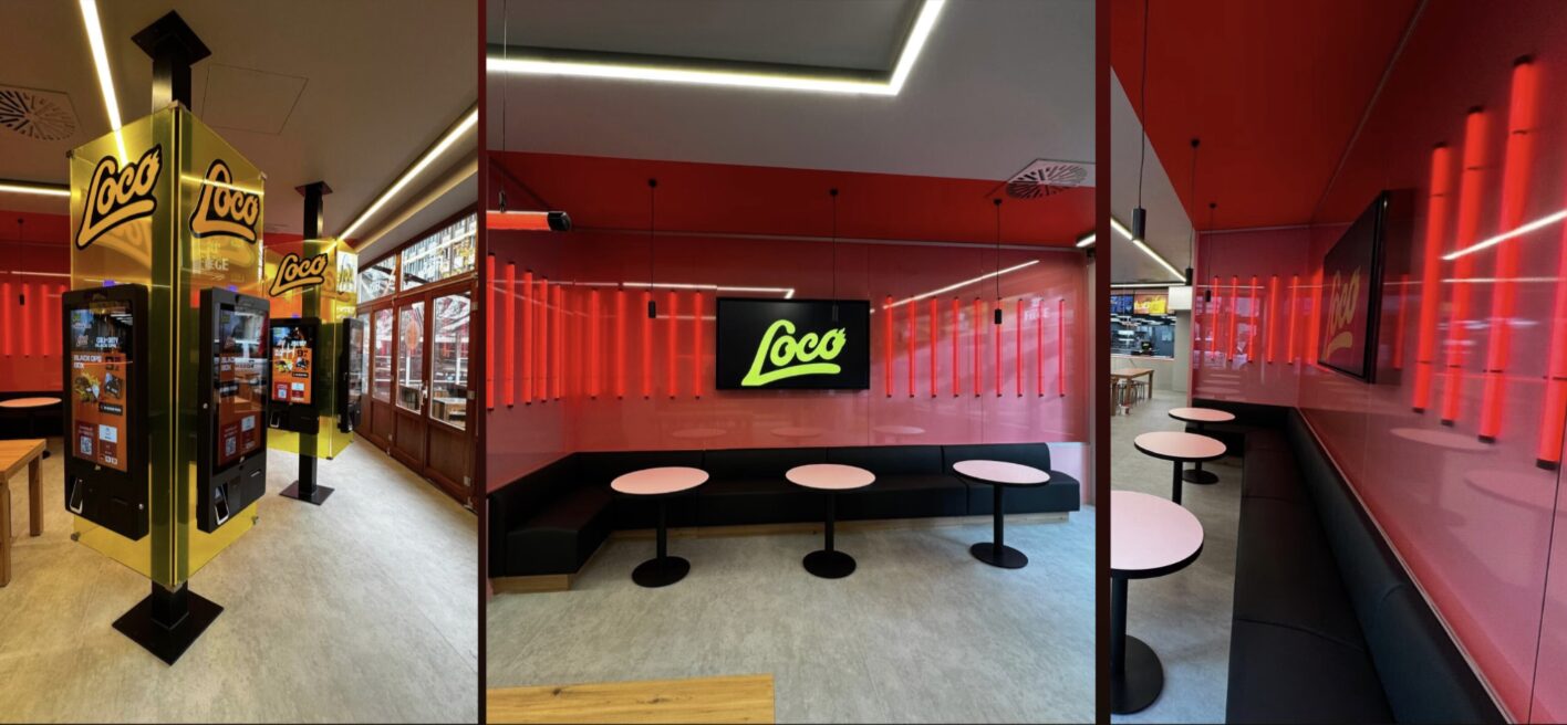 Innenraum eines neuen Loco Chicken Stores mit Bestellterminals, roten Neonröhren und Sitzecken