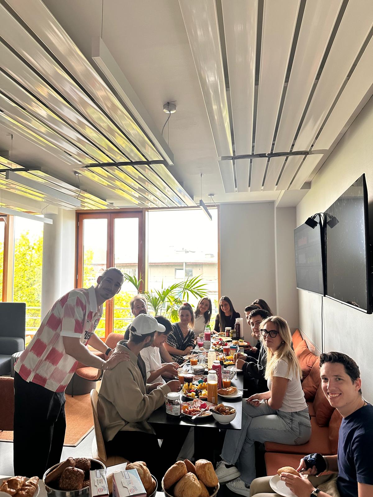 Colleagues sharing breakfast in the office