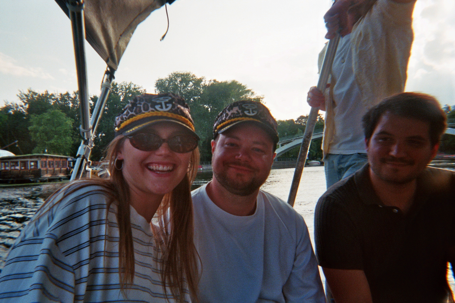 Colleagues in captain hats on a boat trip