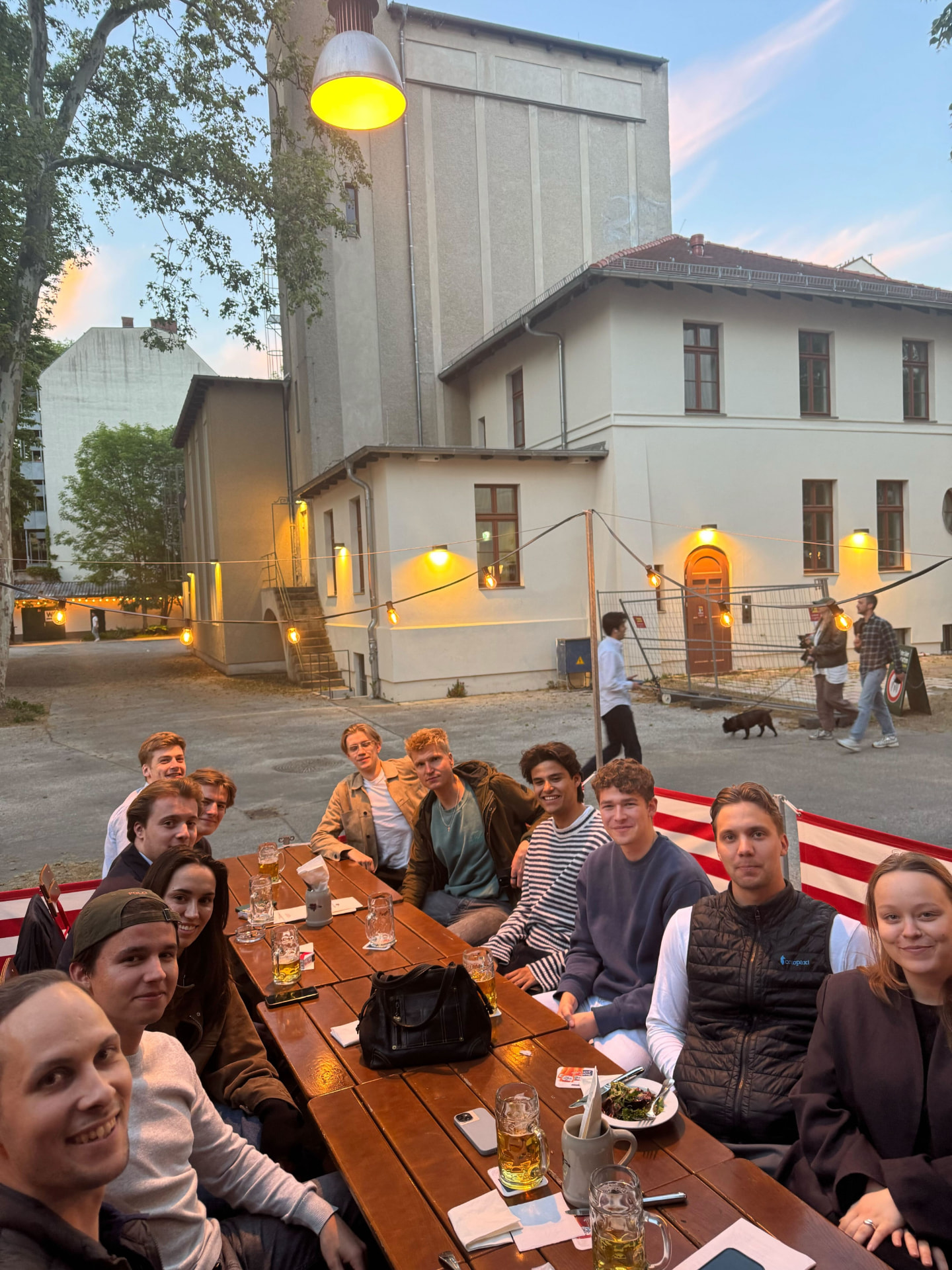 The LANCH team at a long dinner table in a Berlin beer garden
